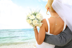 Bride and groom on beach